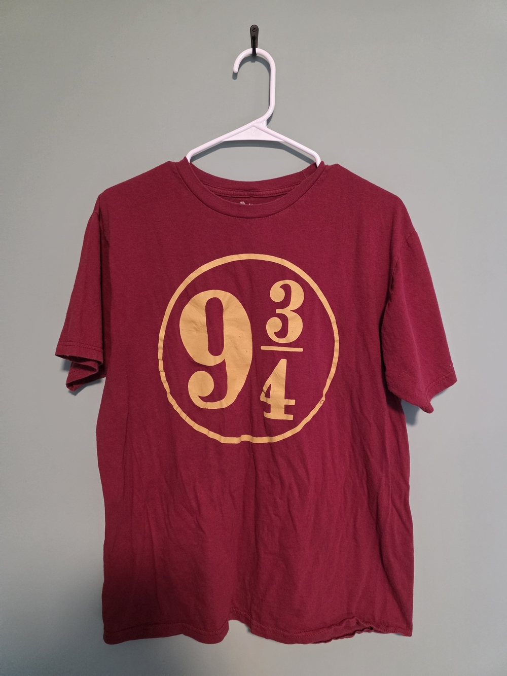 Warner Bros. Burgundy Short-Sleeve Graphic Tee with Gold 9 3/4 Emblem